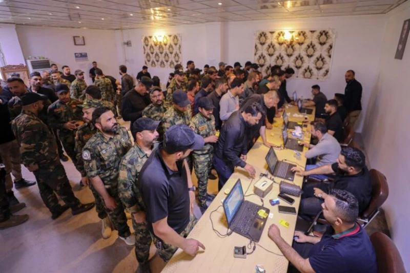 صور وبيان من الهيئة: المباشرة بتوزيع بطاقات "المهندس" على منتسبي الحشد 